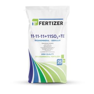 Granular FERTIZER 11-11-11+11SO₃+TE boosting early plant growth, soil structure, and microbial life with balanced nutrition and organic matter.